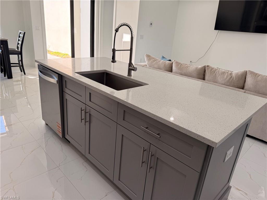 941 Columbus Boulevard Lehigh Acres, FL 33974 - Photo 40 of 41 a close view of sink and tap