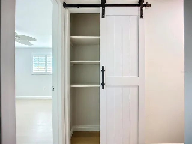 a bathroom with a granite countertop toilet a sink and bathtub