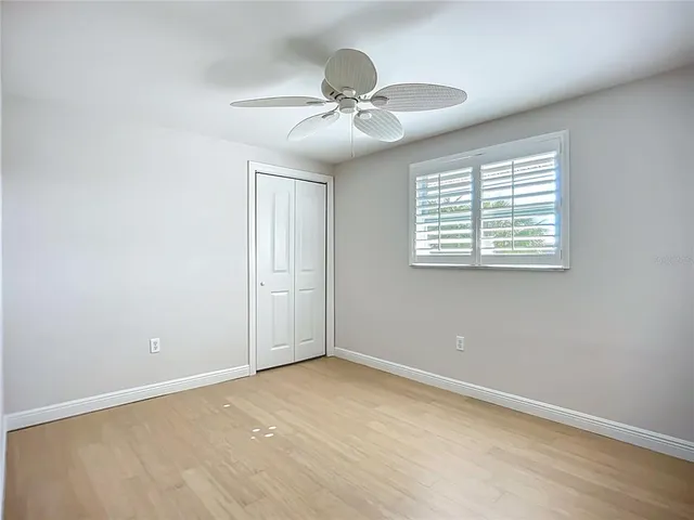 a view of a room with air conditioner duct and empty racks