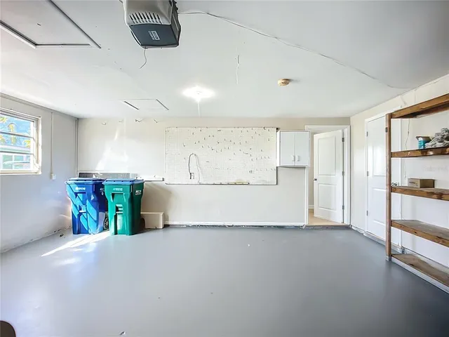 a lobby with furniture and floor to ceiling window