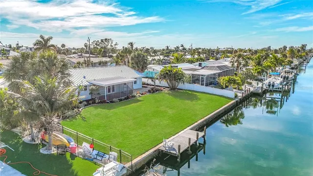 a view of a swimming pool with outdoor seating