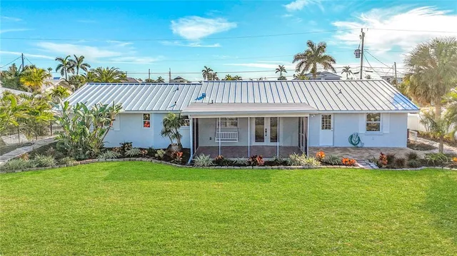 a view of a garden with a building in the background