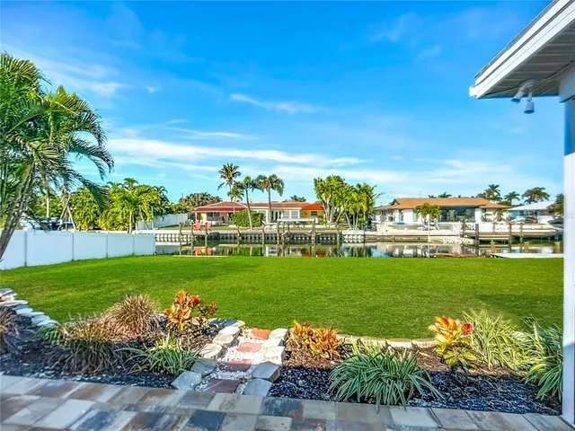 an aerial view of residential building and lake