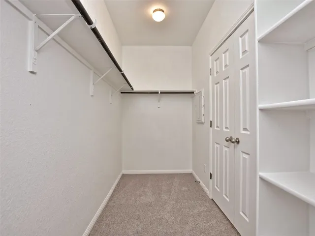 a view of a hallway with a white walls