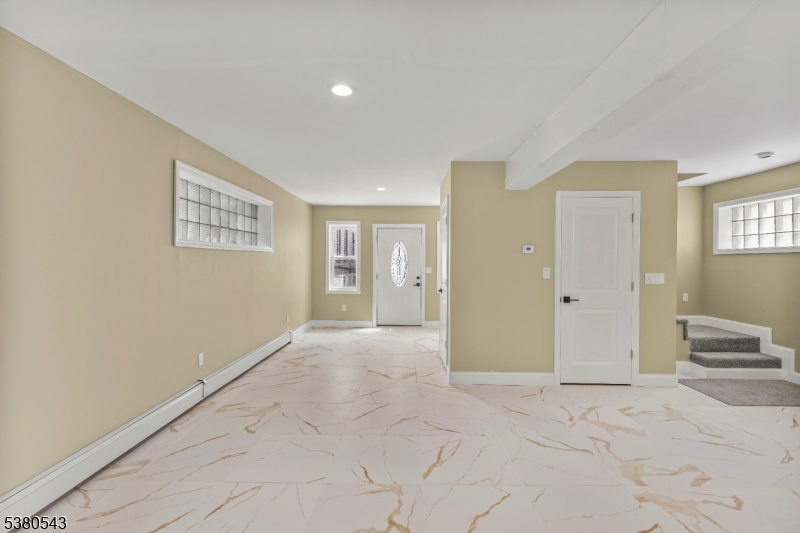 63 Maple Avenue Irvington, NJ 07111 - Photo 11 of 28 a view of livingroom with hardwood floor and bedroom