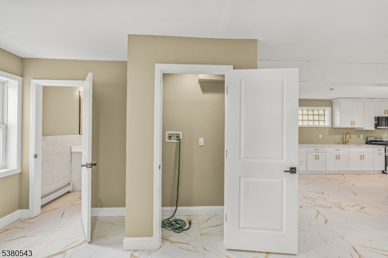 63 Maple Avenue Irvington, NJ 07111 - Photo 12 of 28 a bathroom with a shower and a sink