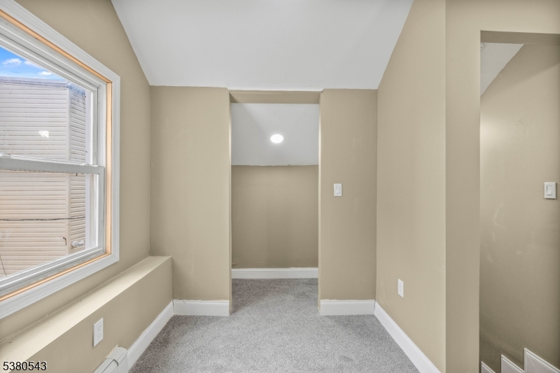 63 Maple Avenue Irvington, NJ 07111 - Photo 17 of 28 a view of an empty room with a window