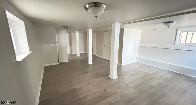 63 Maple Avenue Irvington, NJ 07111 - Photo 27 of 28 an empty room with windows and closet