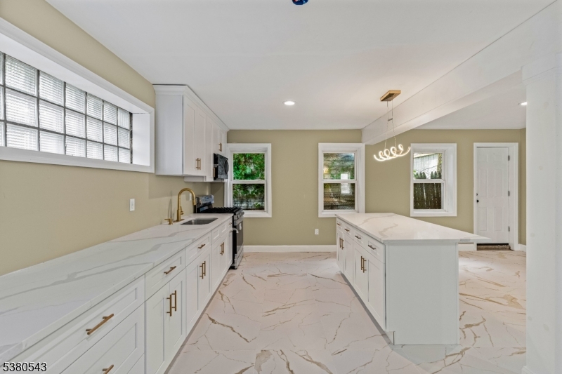 63 Maple Avenue Irvington, NJ 07111 - Photo 6 of 28 a bathroom with a sink and a bathtub