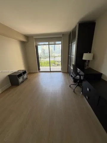 a view of workspace with window and tv