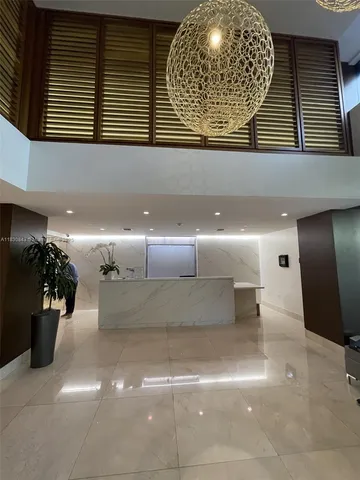 a view of a lobby with a chandelier
