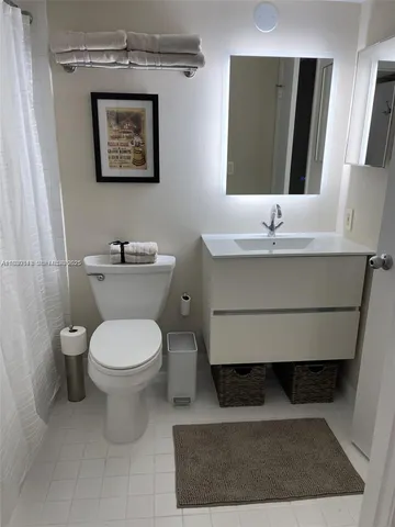a bathroom with a toilet and a sink