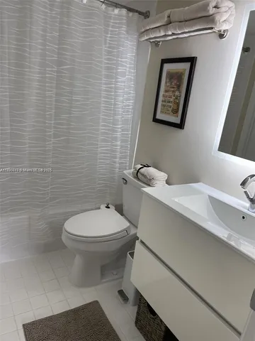 a bathroom with a toilet and a sink