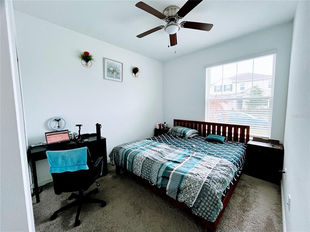 11498 Rhyme Avenue Orlando, FL 32832 - Photo 11 of 17 a bedroom with bed and a window