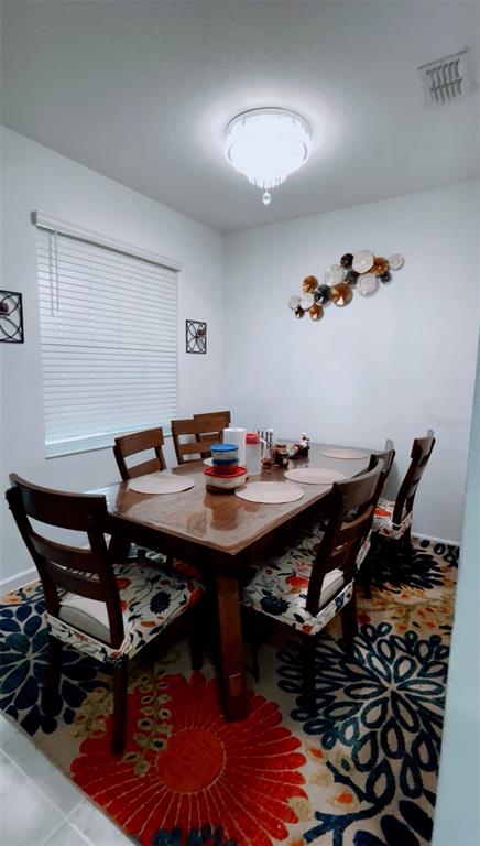 11498 Rhyme Avenue Orlando, FL 32832 - Photo 7 of 17 a view of a workspace with furniture and wooden floor