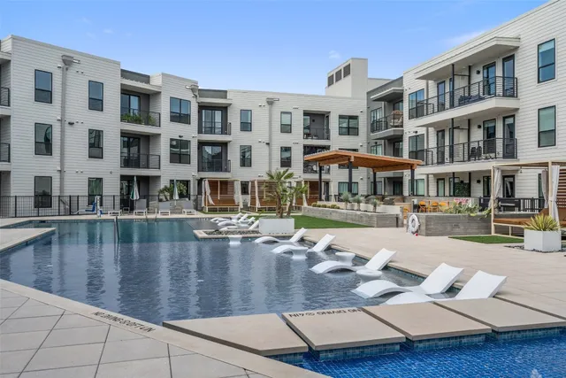 a view of pool with outdoor seating