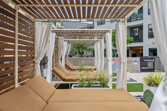 an aerial view of a house with wooden floor and windows