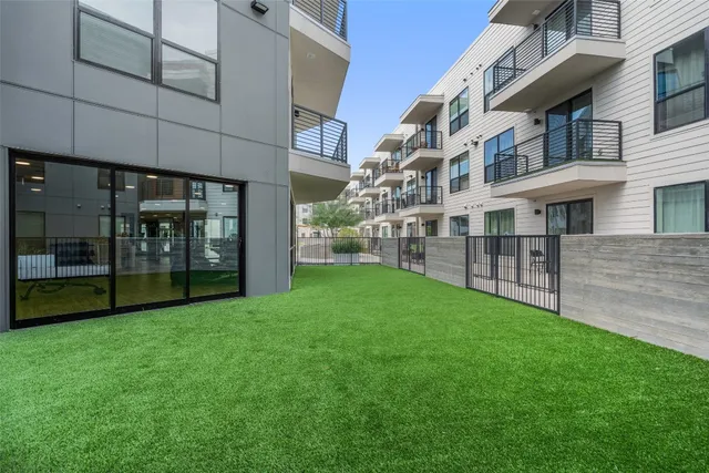 a living room with furniture a fireplace and a table