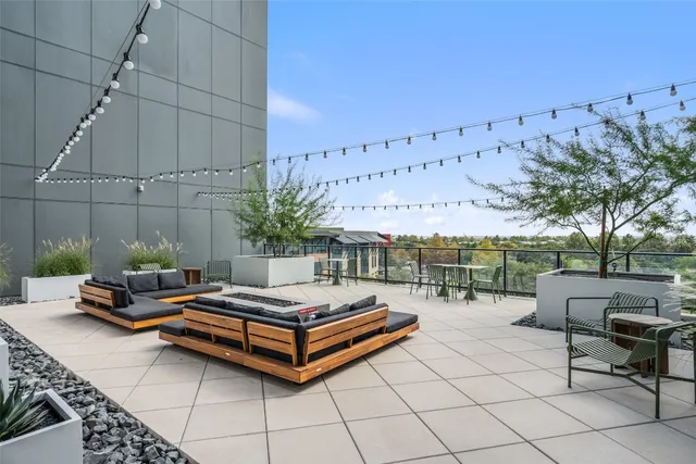 a view of a a dining room with furniture window and wooden floor