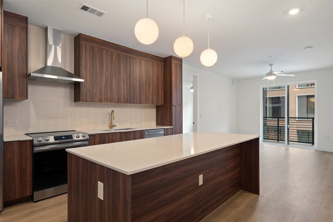 1701 Simond Avenue, Unit 206 Austin, TX 78723 - Photo 6 of 37 a kitchen with a stove and a sink
