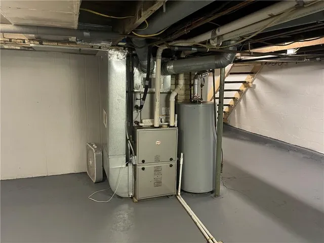 a view of storage and utility room with stairs