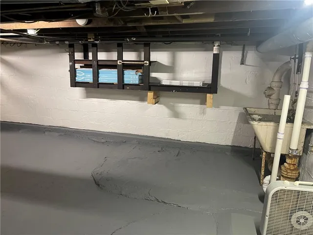 a view of walk in closet with clothes