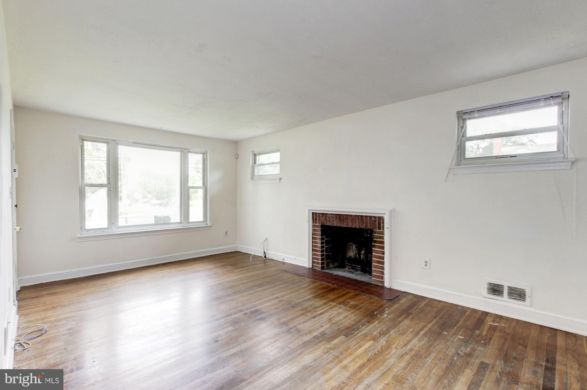 8537 Riggs Road Hyattsville, MD 20783 - Photo 8 of 31 Living Room with Fireplace