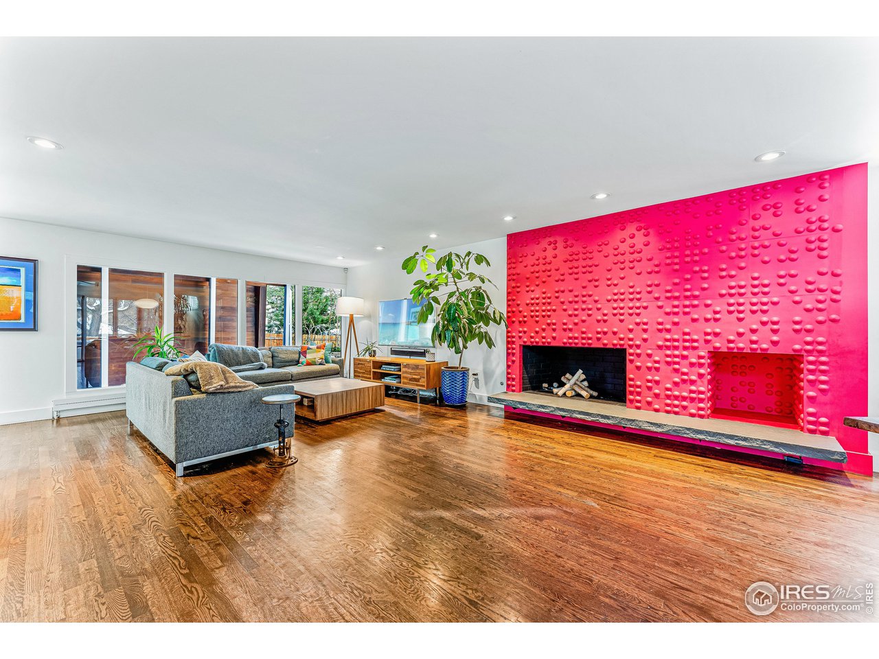 3560 9th Street Boulder, CO 80304 - Photo 12 of 39 a living room with furniture and a fireplace