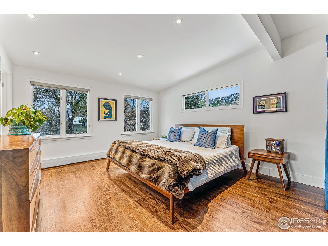 3560 9th Street Boulder, CO 80304 - Photo 23 of 39 a spacious bedroom with a bed and a table