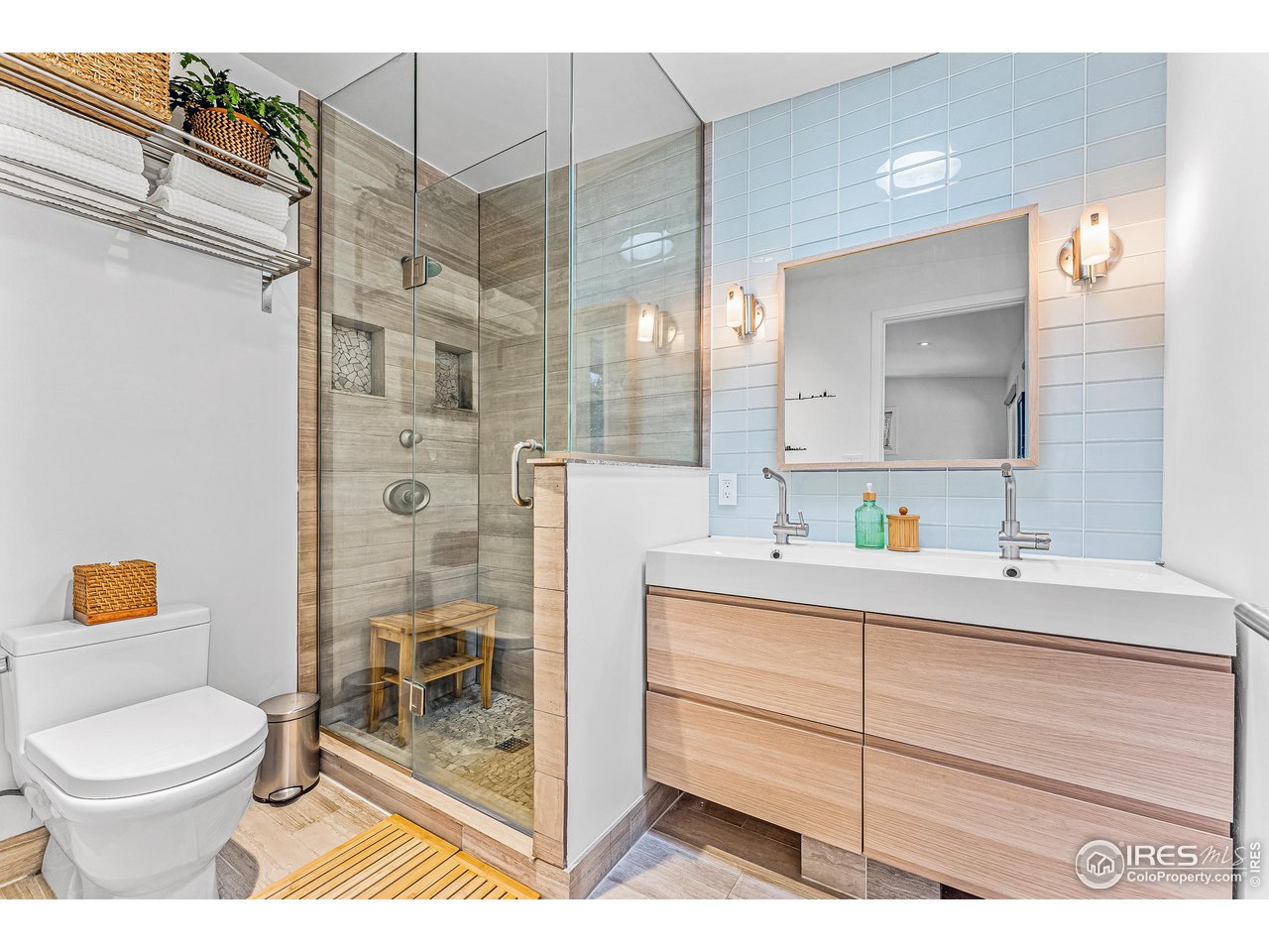 3560 9th Street Boulder, CO 80304 - Photo 25 of 39 a bathroom with a toilet sink vanity and shower