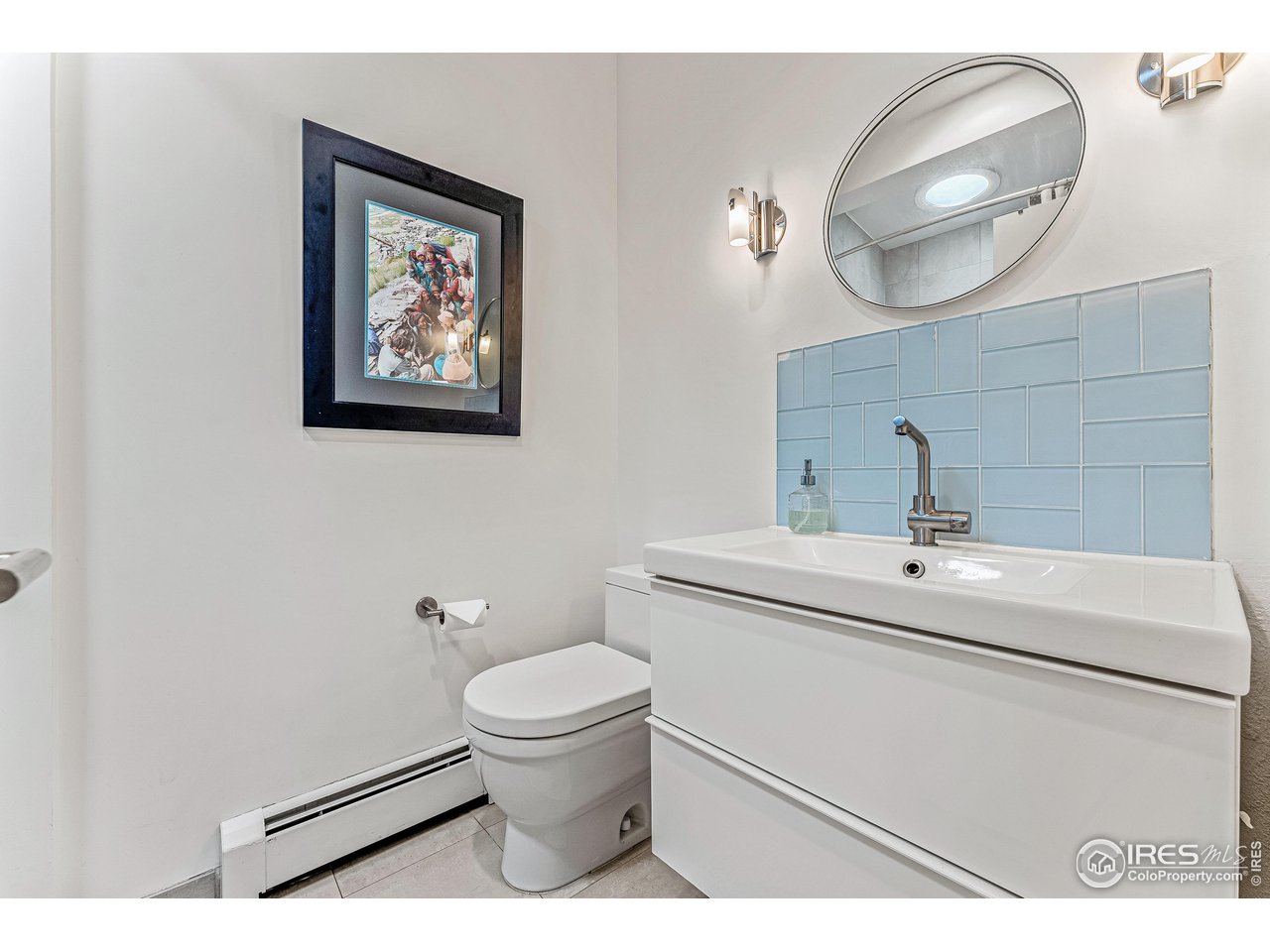 3560 9th Street Boulder, CO 80304 - Photo 29 of 39 a bathroom with a toilet a sink and mirror