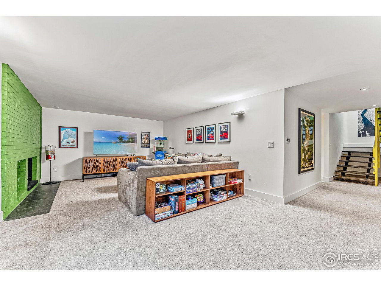 3560 9th Street Boulder, CO 80304 - Photo 32 of 39 a living room with furniture and a book shelf