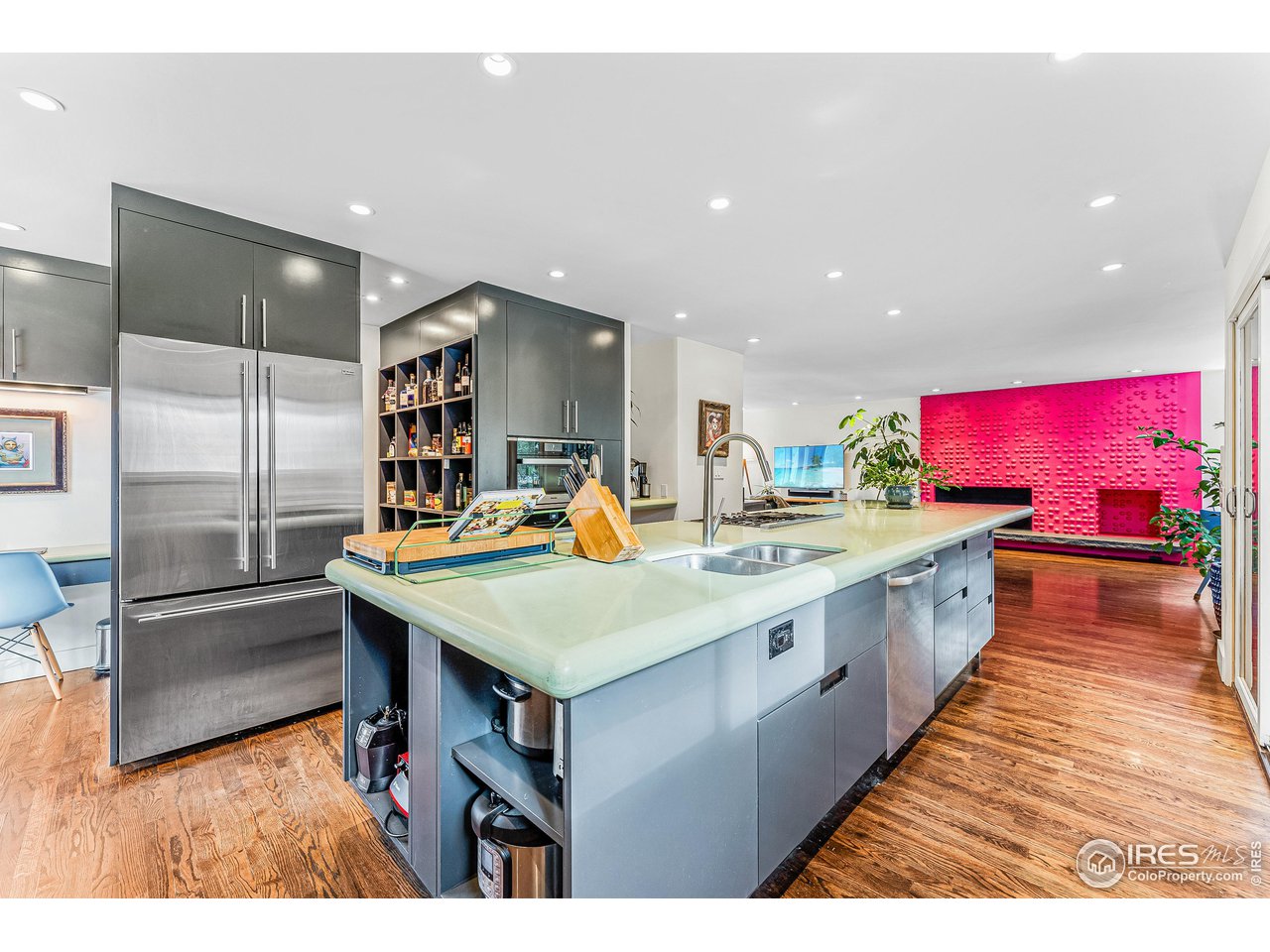 3560 9th Street Boulder, CO 80304 - Photo 6 of 39 a large kitchen with kitchen island a sink and a wooden floor
