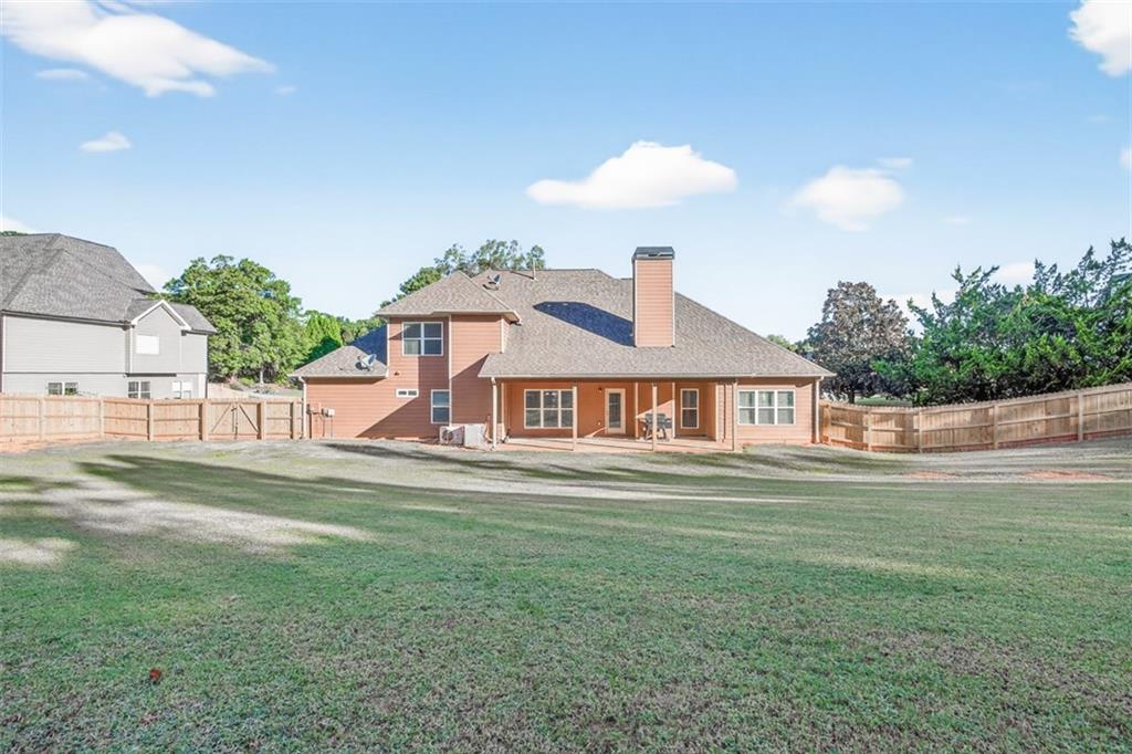 236 Reece Drive Hoschton, GA 30548 - Photo 3 of 58 a front view of a house with a yard