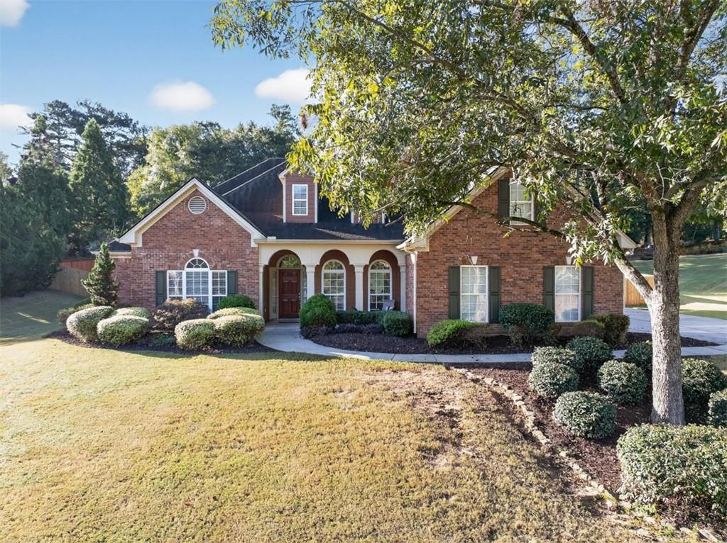 236 Reece Drive Hoschton, GA 30548 - Photo 46 of 58 a front view of a house with yard