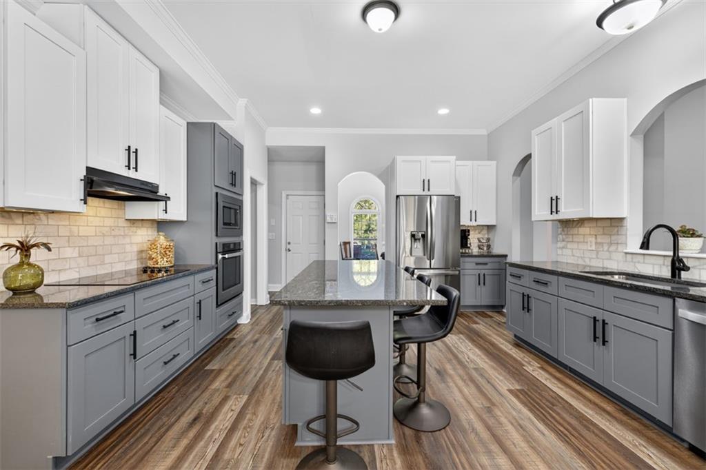 236 Reece Drive Hoschton, GA 30548 - Photo 5 of 58 a large kitchen with cabinets