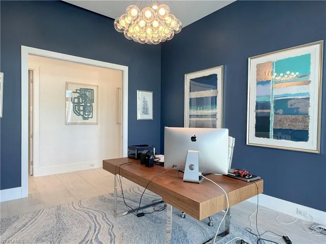 a workspace with furniture and window