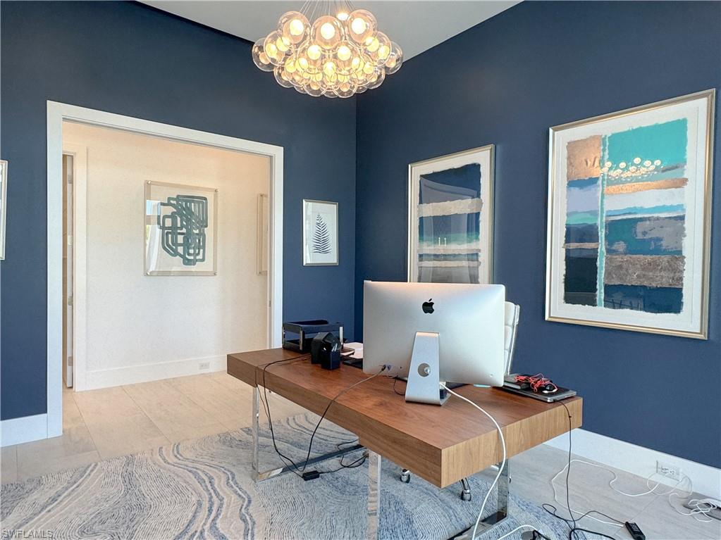3123 Crayton Road Naples, FL 34103 - Photo 35 of 50 a workspace with furniture and window