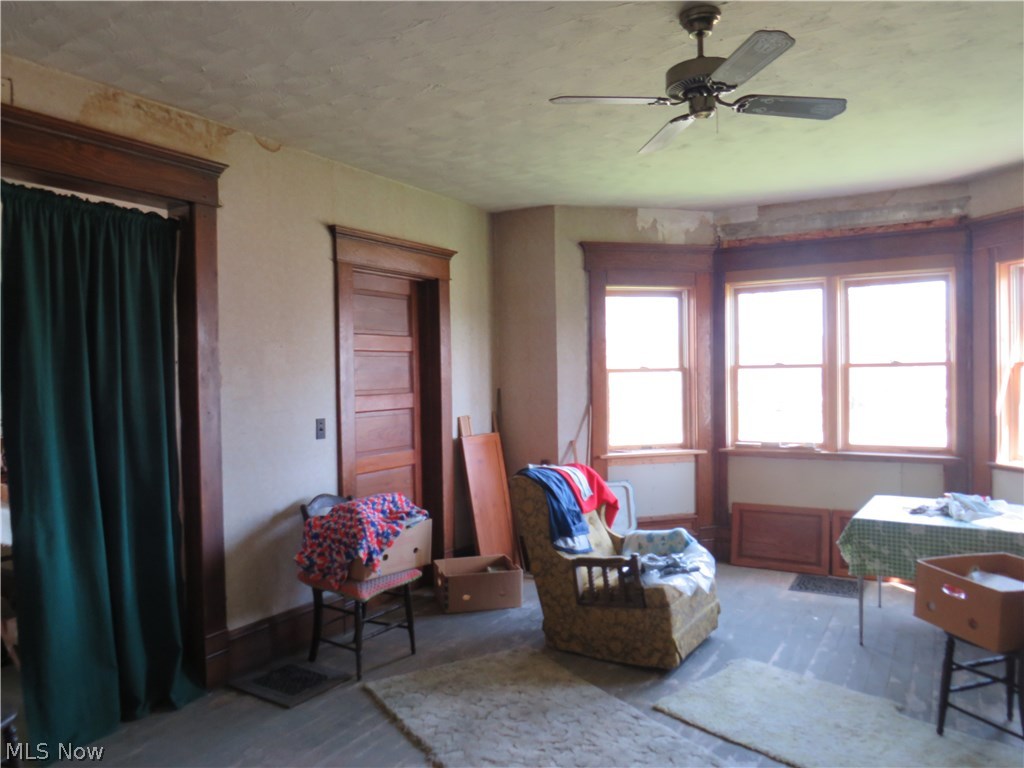 5660 Highway 6 Rome, OH 44085 - Photo 7 of 12 Newer windows, but need to work on the trim details. The woodwork is there which is a great asset!