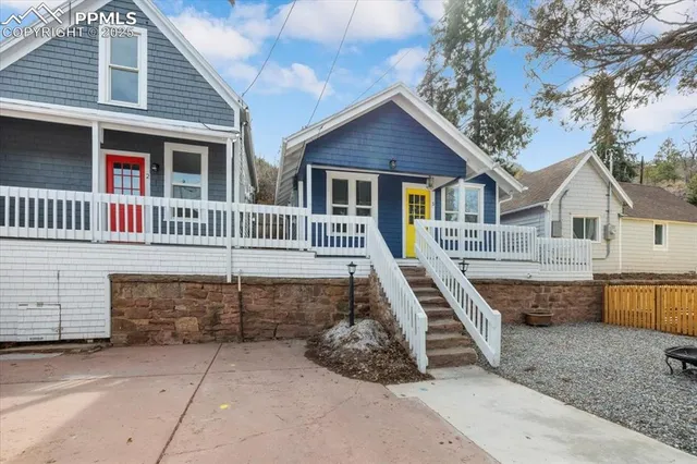 a front view of a house with a wooden fence