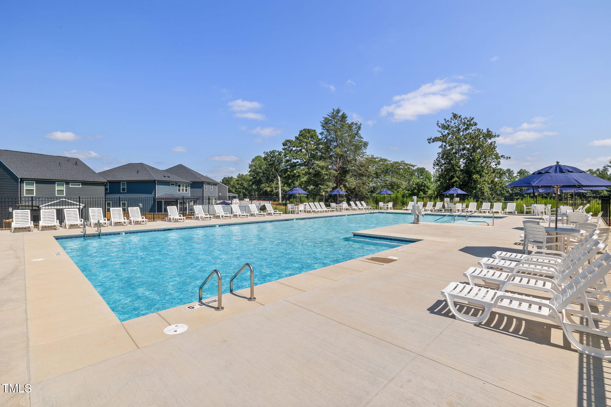 1382 Rowboat Road Apex, NC 27502 - Photo 12 of 19 a view of swimming pool with outdoor seating and trees in the background
