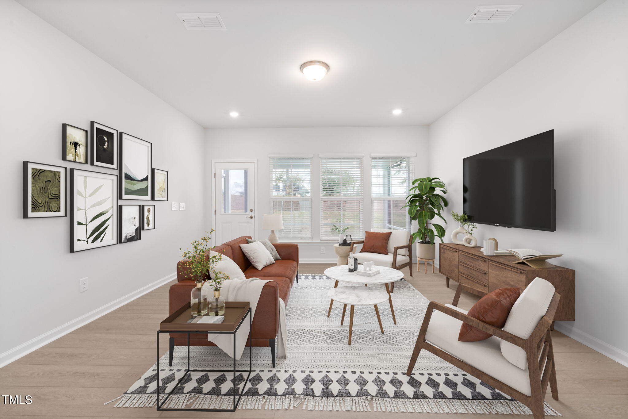 1382 Rowboat Road Apex, NC 27502 - Photo 5 of 19 a living room with furniture a flat screen tv and a large window