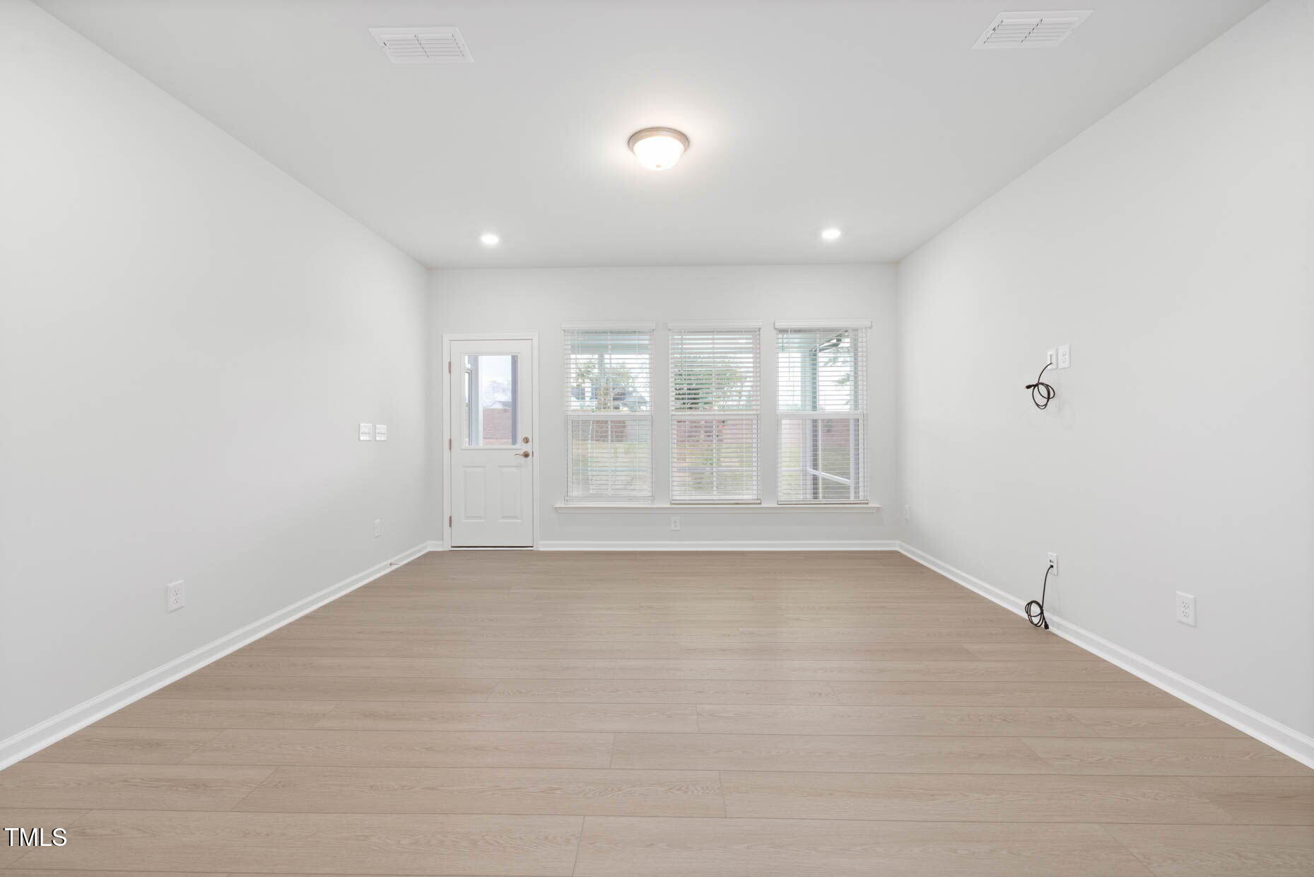 1382 Rowboat Road Apex, NC 27502 - Photo 7 of 19 a view of an empty room with a window