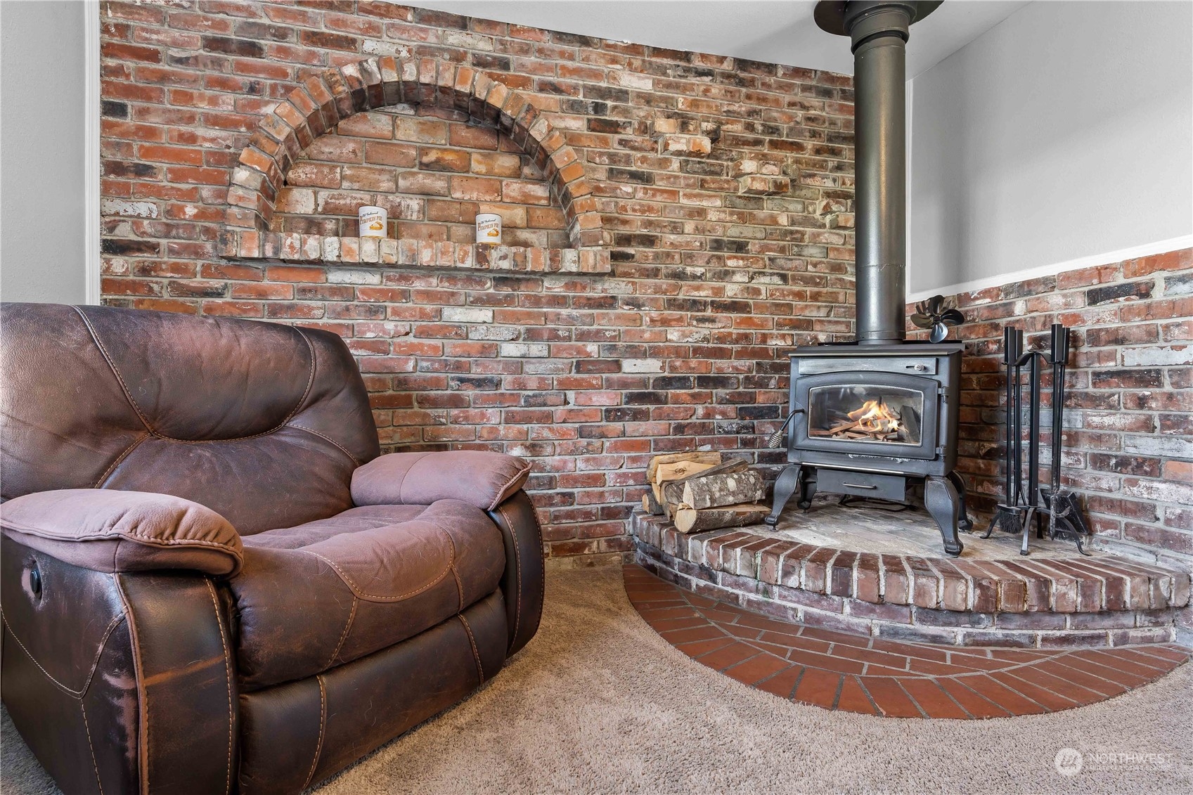 1693 Collins Road Buckley, WA 98321 - Photo 8 of 35 a living room with furniture and a fireplace