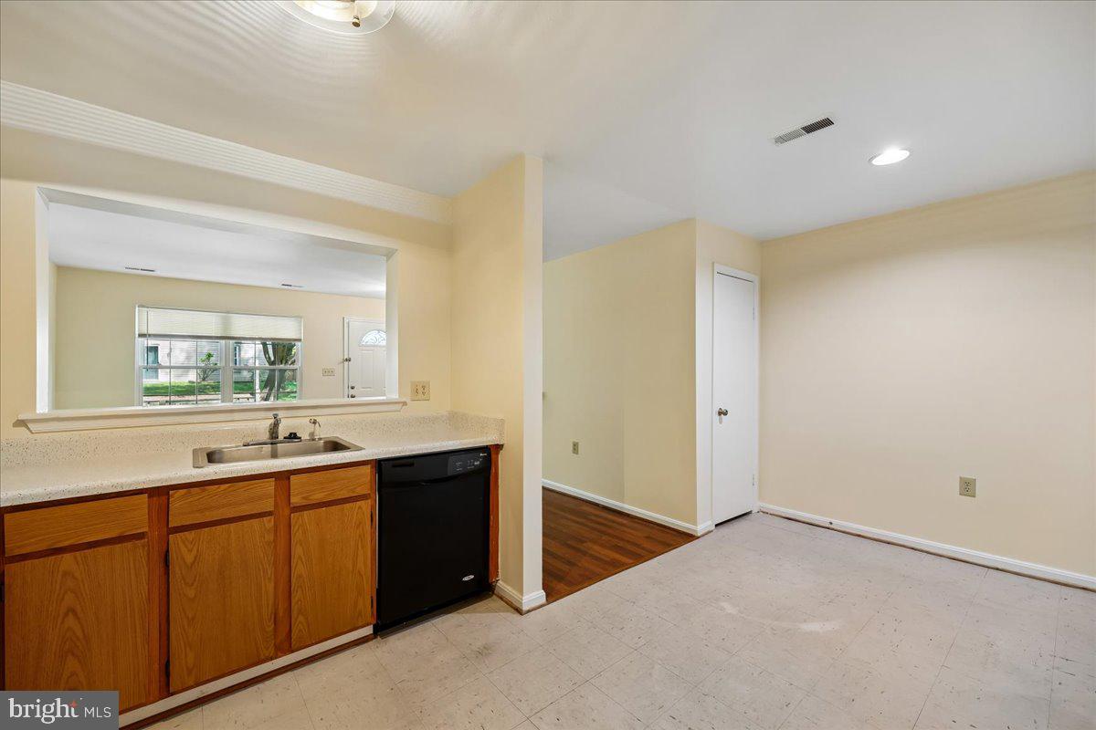 18012 Golden Spring Court, Unit 239 Olney, MD 20832 - Photo 17 of 44 a bathroom with a sink and a mirror