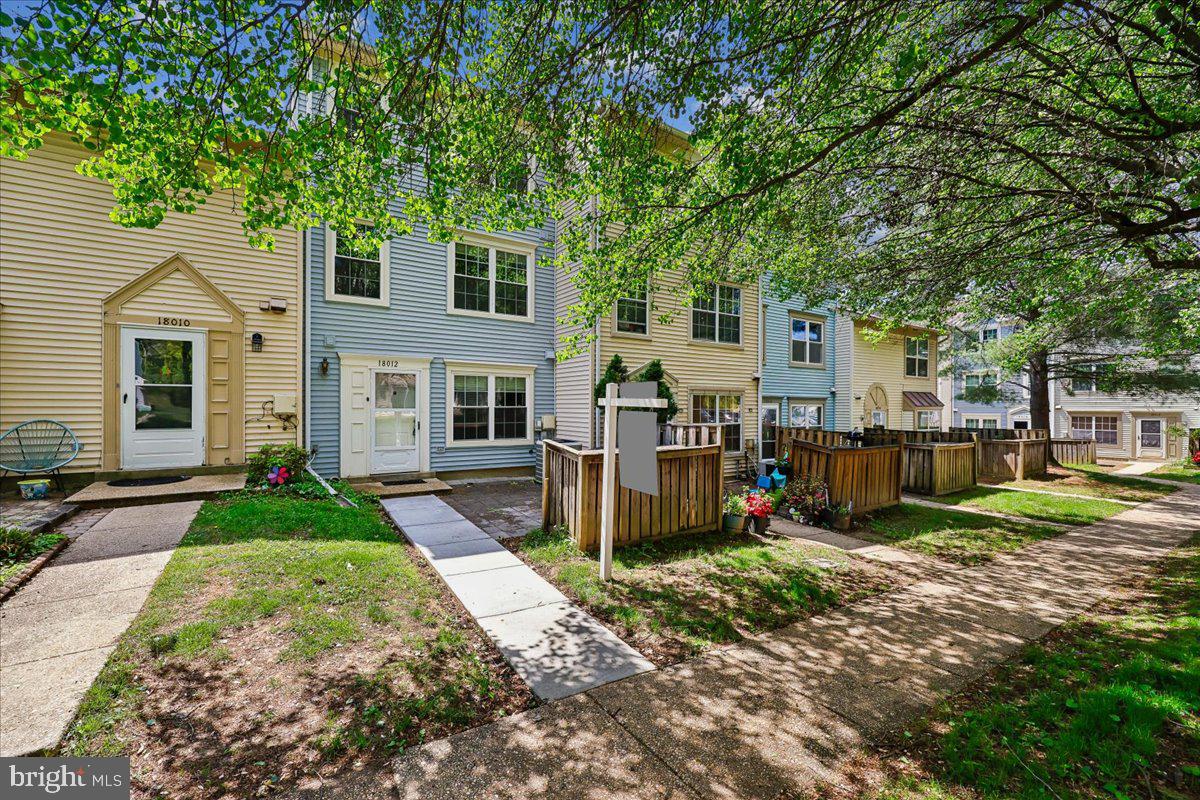 18012 Golden Spring Court, Unit 239 Olney, MD 20832 - Photo 2 of 44 front view of a house with a yard