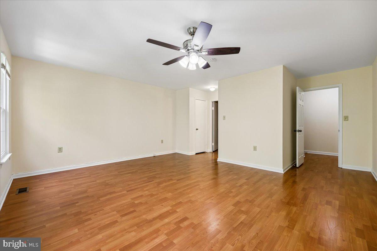 18012 Golden Spring Court, Unit 239 Olney, MD 20832 - Photo 21 of 44 wooden floor in an empty room