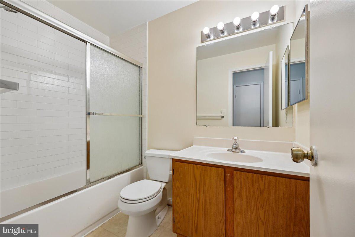 18012 Golden Spring Court, Unit 239 Olney, MD 20832 - Photo 26 of 44 a bathroom with a sink a toilet and shower
