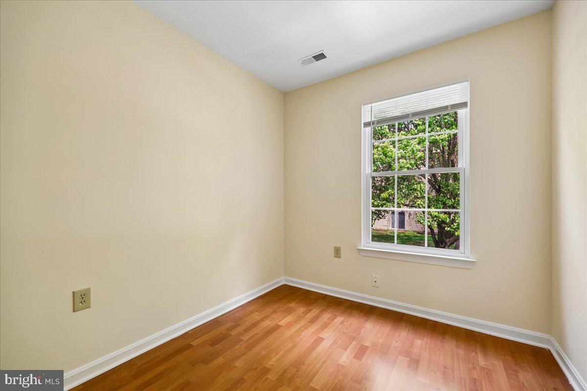 18012 Golden Spring Court, Unit 239 Olney, MD 20832 - Photo 30 of 44 an empty room with a window