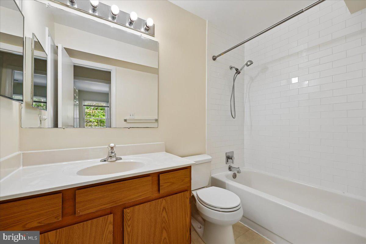 18012 Golden Spring Court, Unit 239 Olney, MD 20832 - Photo 31 of 44 a bathroom with a sink a toilet and a bathtub